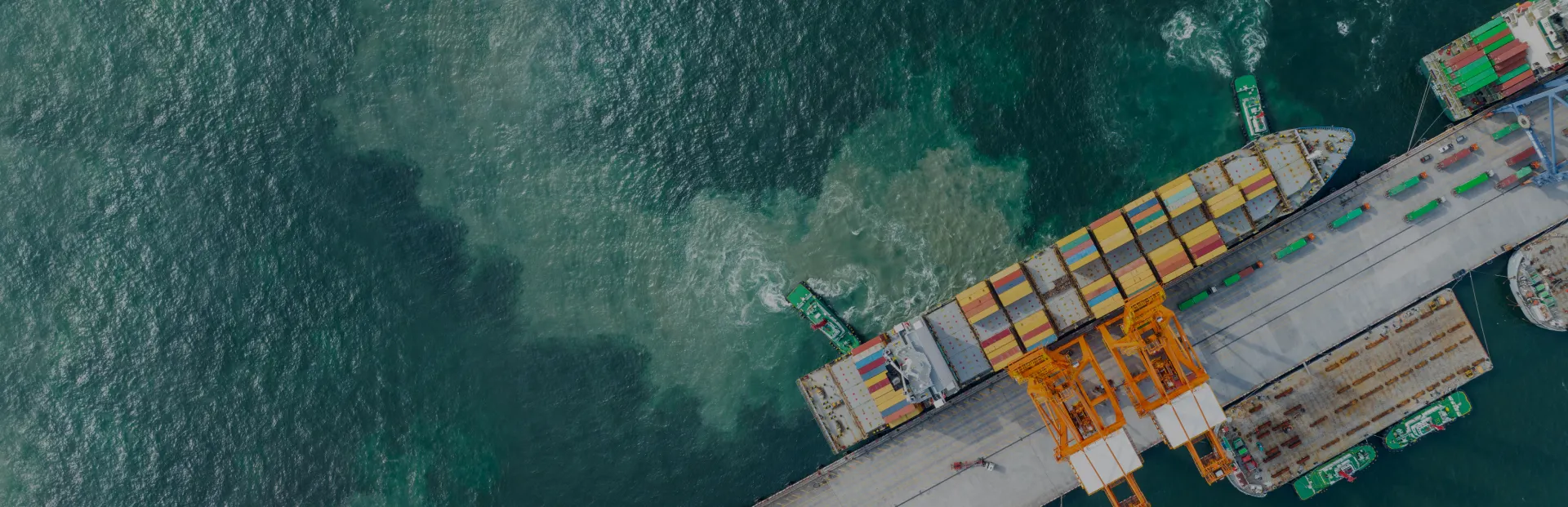TOP Worldwide shipping containers on an ocean vessel highlighting reliable drayage services for smooth import and export logistics.