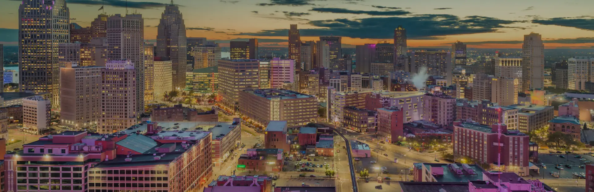 Detroit skyline for Industry News and Updates Blog on TOP Worldwide, featuring logistics and transportation visuals symbolizing trucking, shipping, and global freight updates